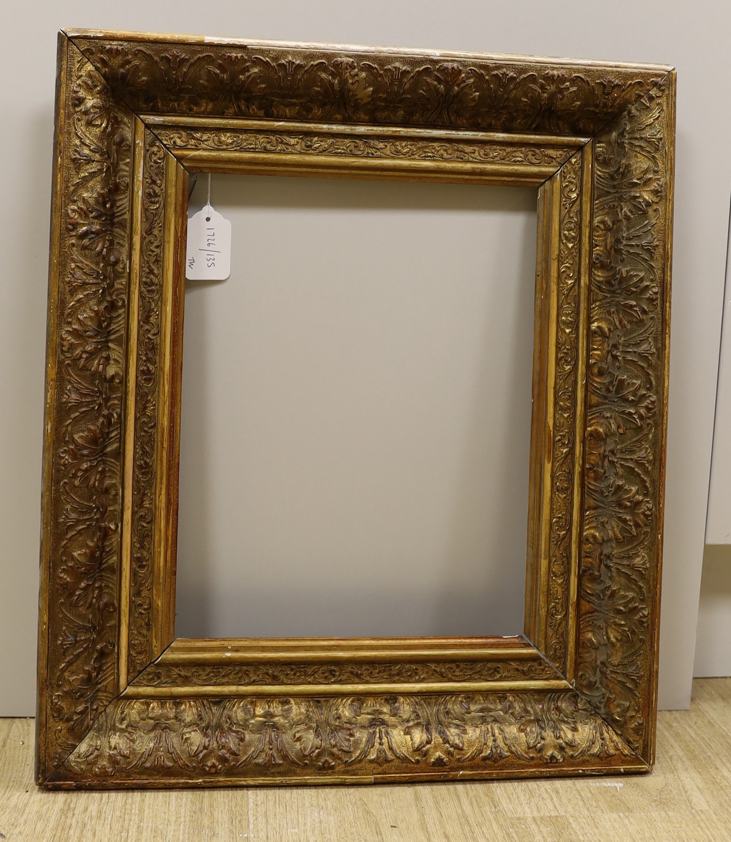 A 19th century giltwood and gesso picture frame, aperture 35 x 27cm, an embossed metal plaque and five assorted engravings